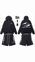 Conjunto negro con cierre y shorts | gráfico blanco, fotografía del artículo proporcionada por la tienda